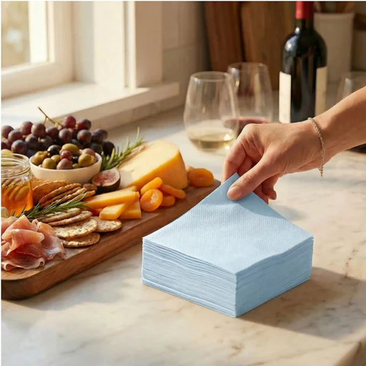 Light blue Singular napkins beside an elegant charcuterie setting